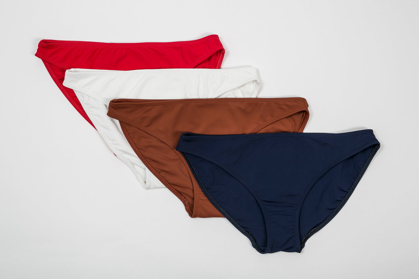 a collection of bathing suit bottoms